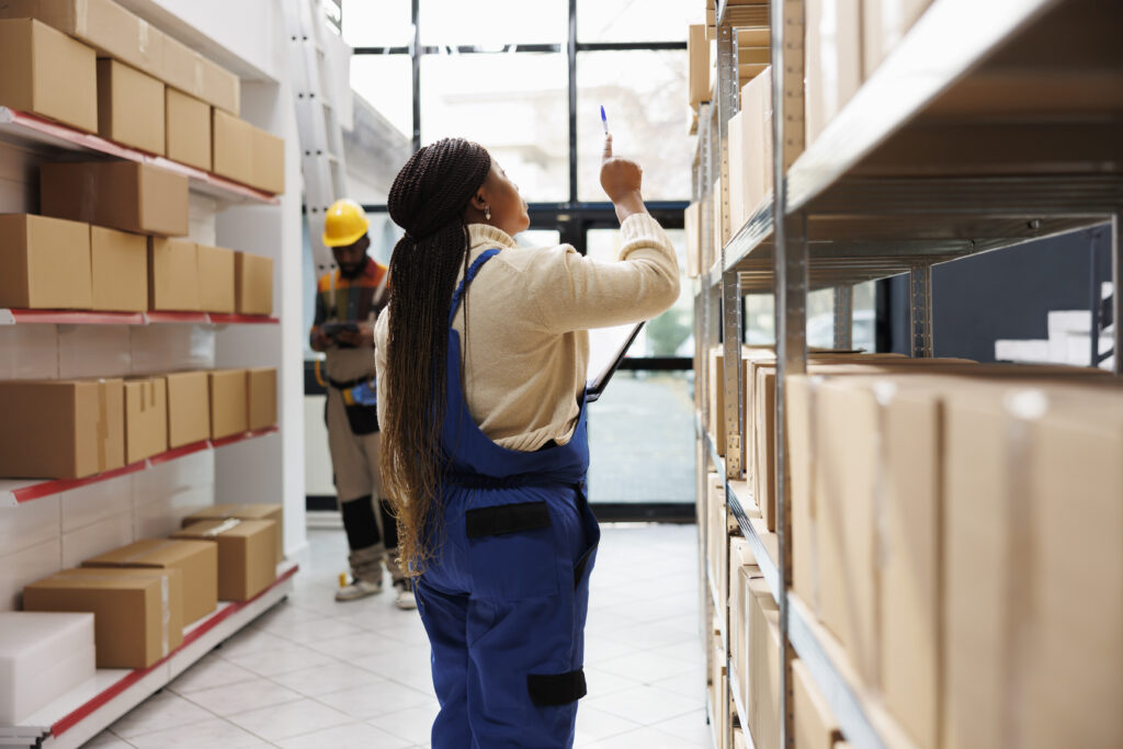 african american storehouse manager checking parcels maintenance